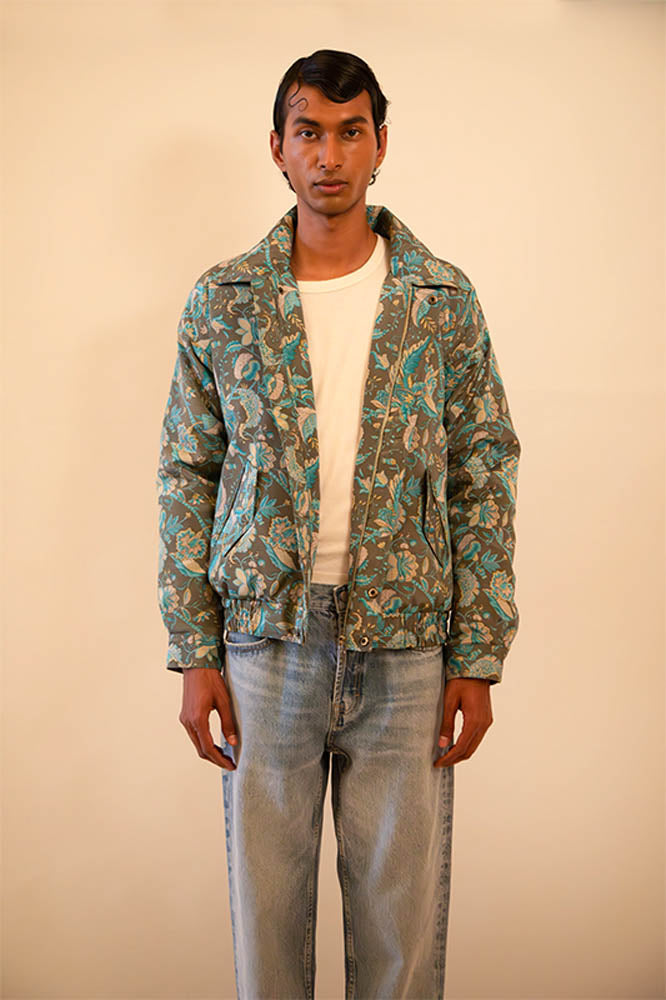 Green paisley silk bomber jacket handcrafted from a vintage sari, lined with soft fleece and finished with a hidden zip detail
