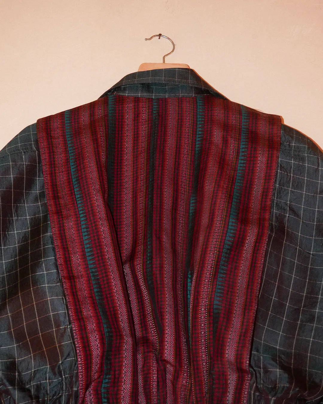 AMBR is our one-of-a-kind cropped two-toned silk brocade reversible bomber, handcrafted by skilled artisans in-house using two vintage silk saris.