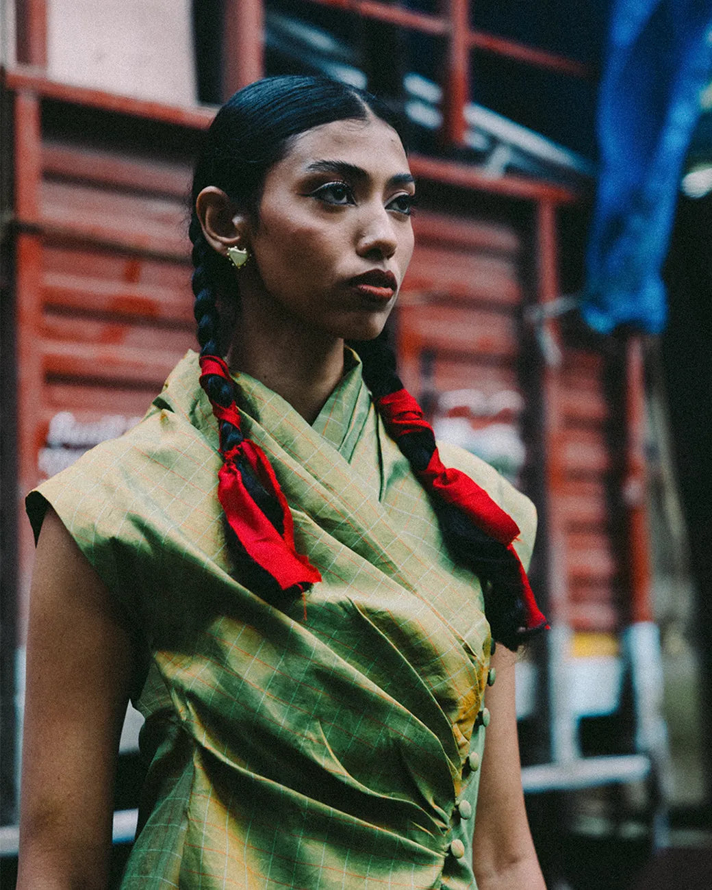 Antrikha asymmetrical silk top with folded neckline and side buttoned flap drape