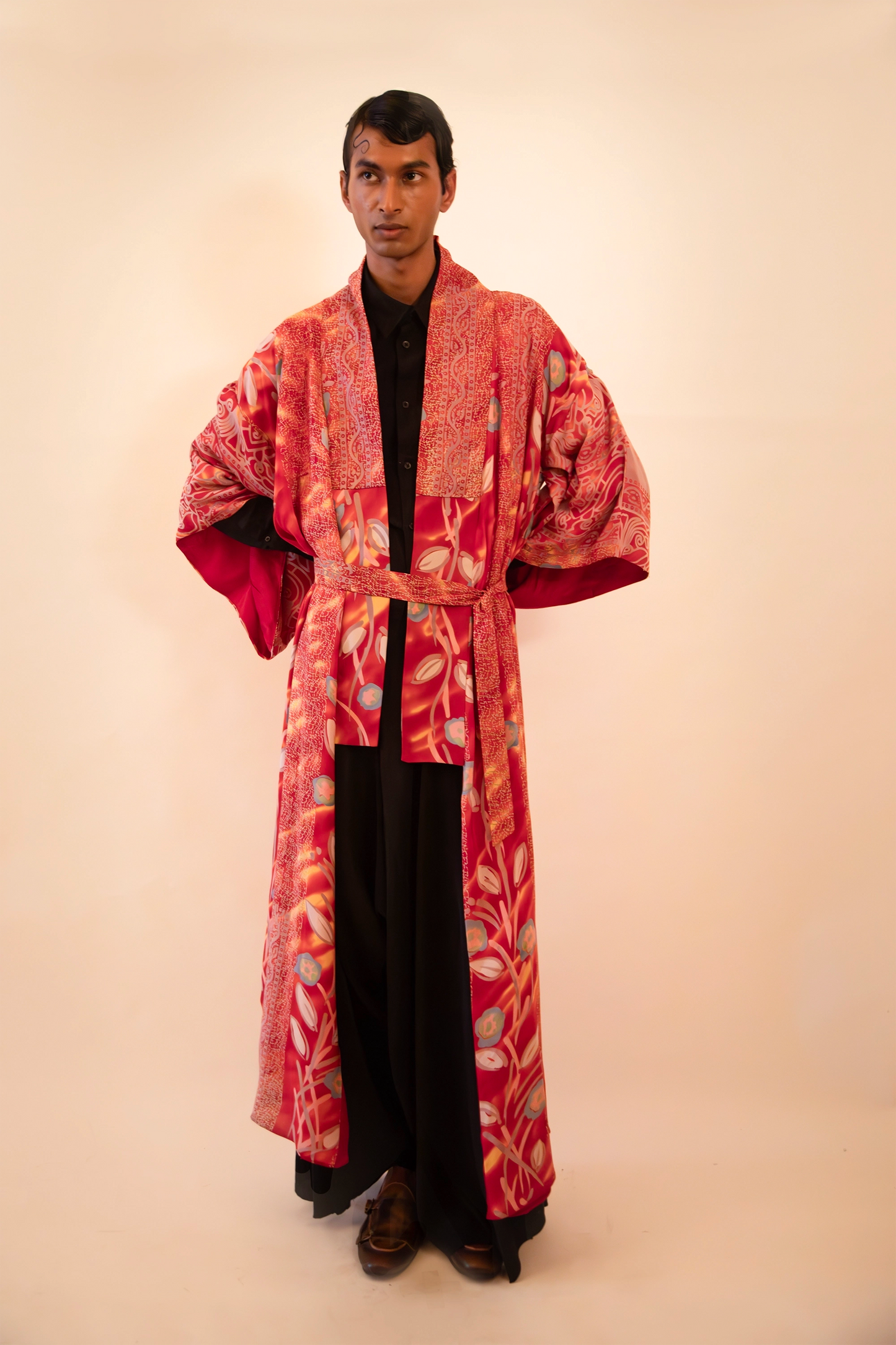 Lalita is our one-of-a-kind red printed silk kimono, handcrafted by skilled artisans in-house using a vintage silk sari.