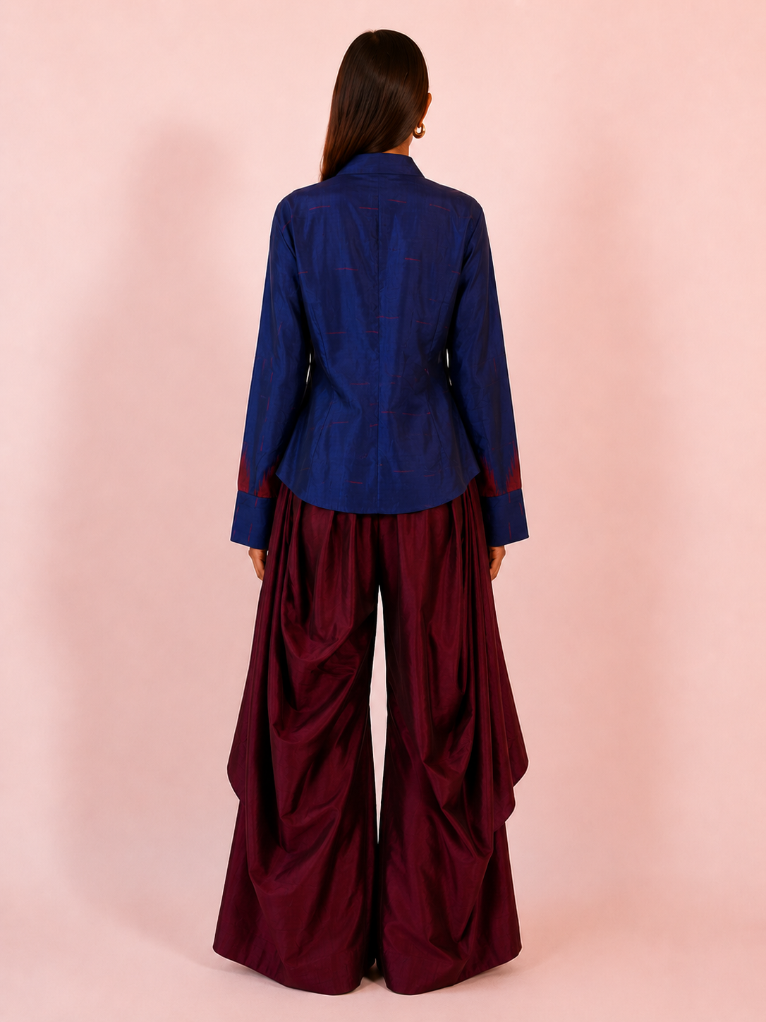 VASTRAM II is our one-of-a-kind loose-fitting outer tunic, handcrafted in-house with a layered, asymmetrical fall and patched full sleeves.
