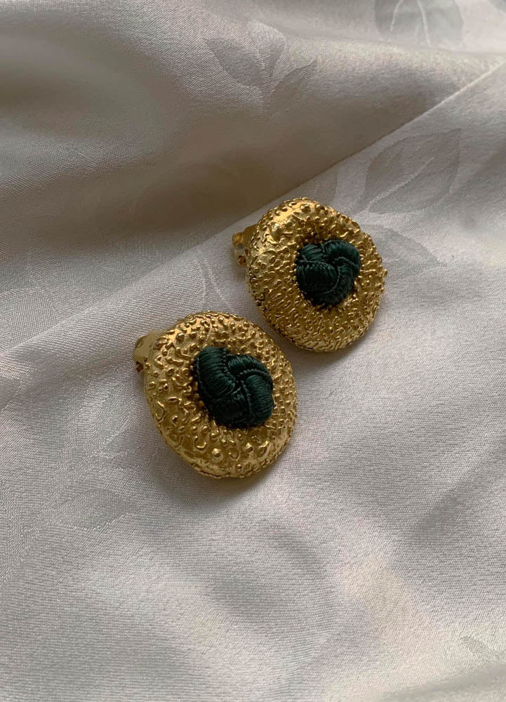 Vintage gold clip-on earrings with central fabric knot detail, handpicked in Paris.