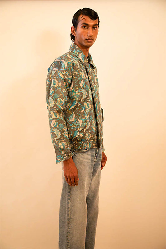 Green paisley silk bomber jacket handcrafted from a vintage sari, lined with soft fleece and finished with a hidden zip detail
