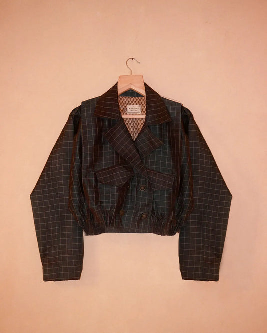 AMBR is our one-of-a-kind cropped two-toned silk brocade reversible bomber, handcrafted by skilled artisans in-house using two vintage silk saris.