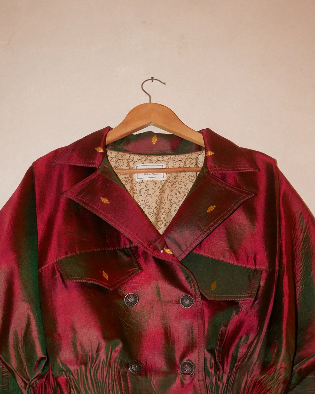 AMBR is our one-of-a-kind cropped two-toned silk brocade reversible bomber, handcrafted by skilled artisans in-house using two vintage silk saris.