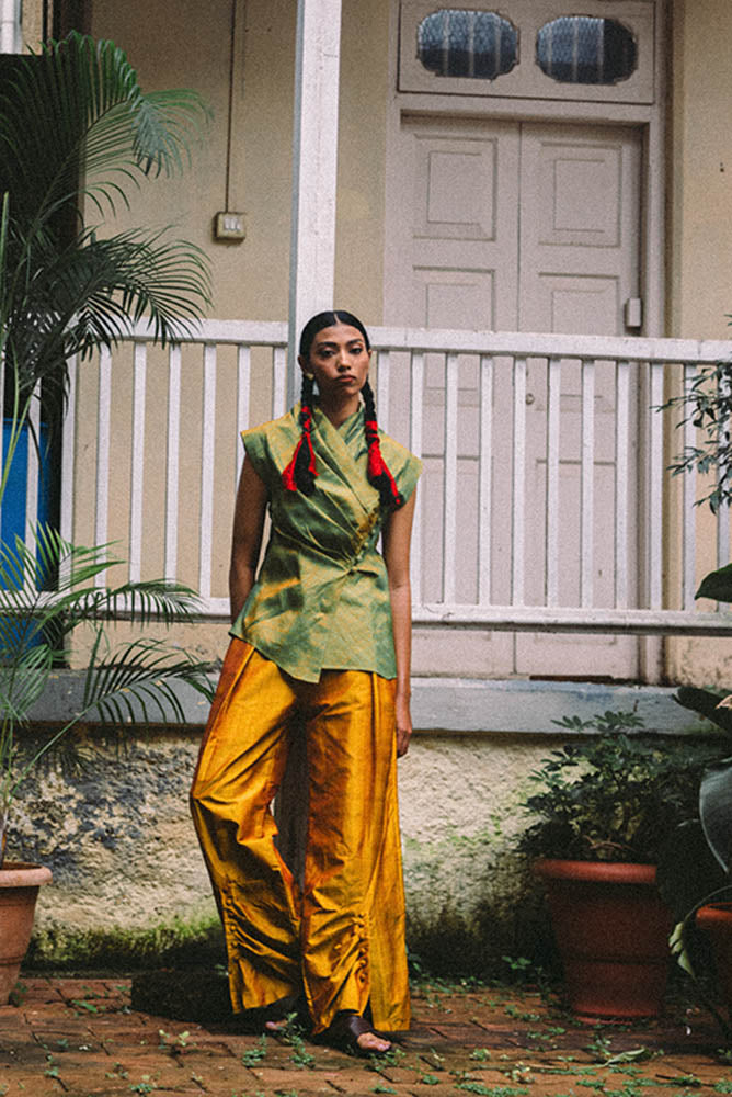 Antrikha asymmetrical silk top with folded neckline and side buttoned flap drape