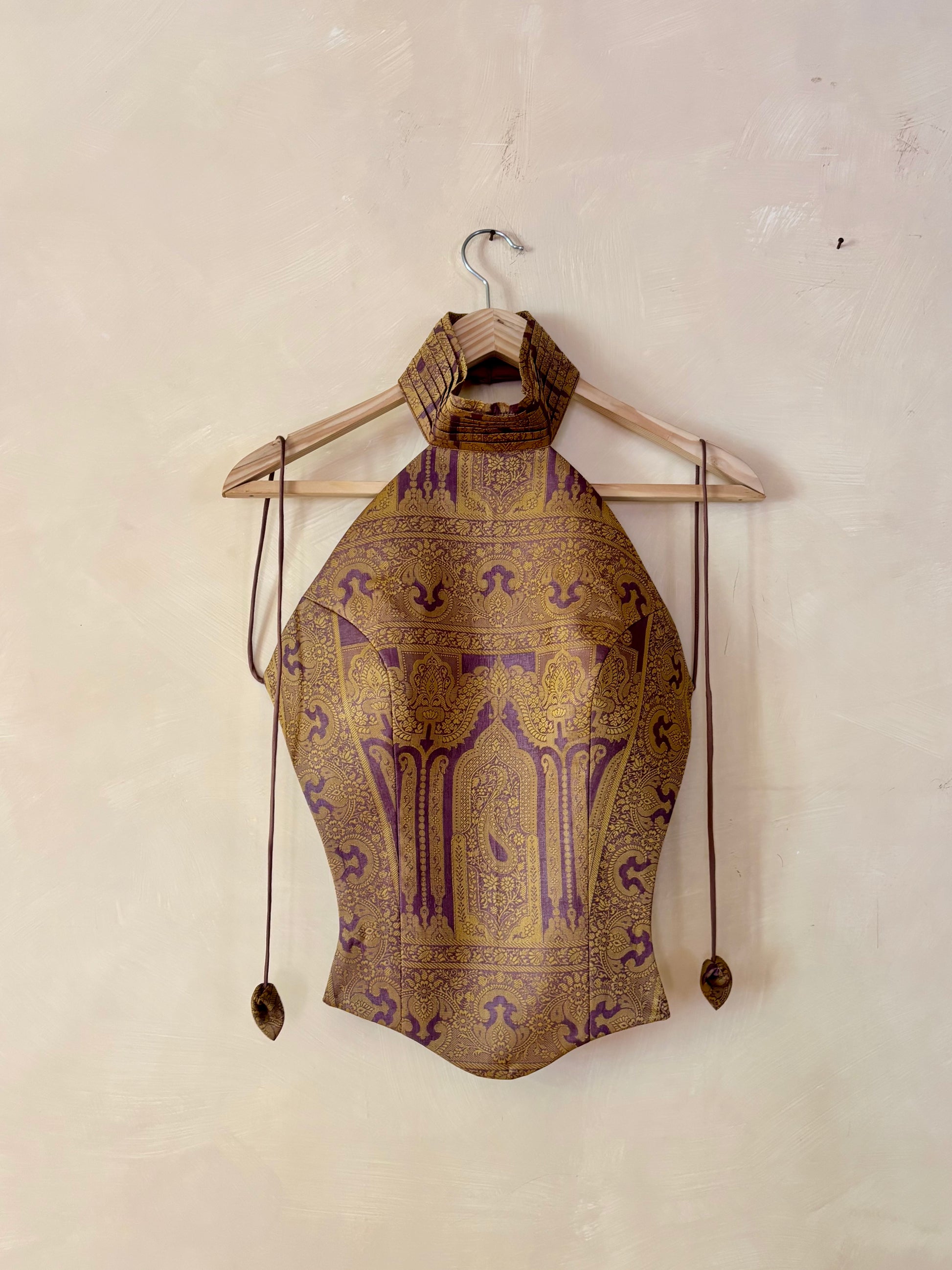 APSARA VIII is our high-neck, backless top crafted from a vintage silk saree, inhouse by skilled artisans. 