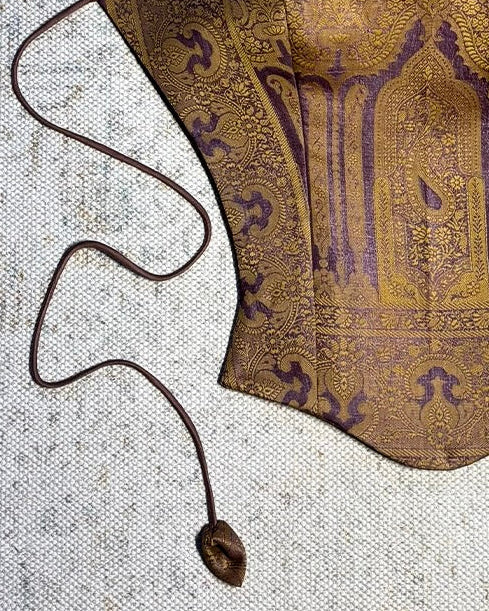 APSARA VIII is our high-neck, backless top crafted from a vintage silk saree, inhouse by skilled artisans. 