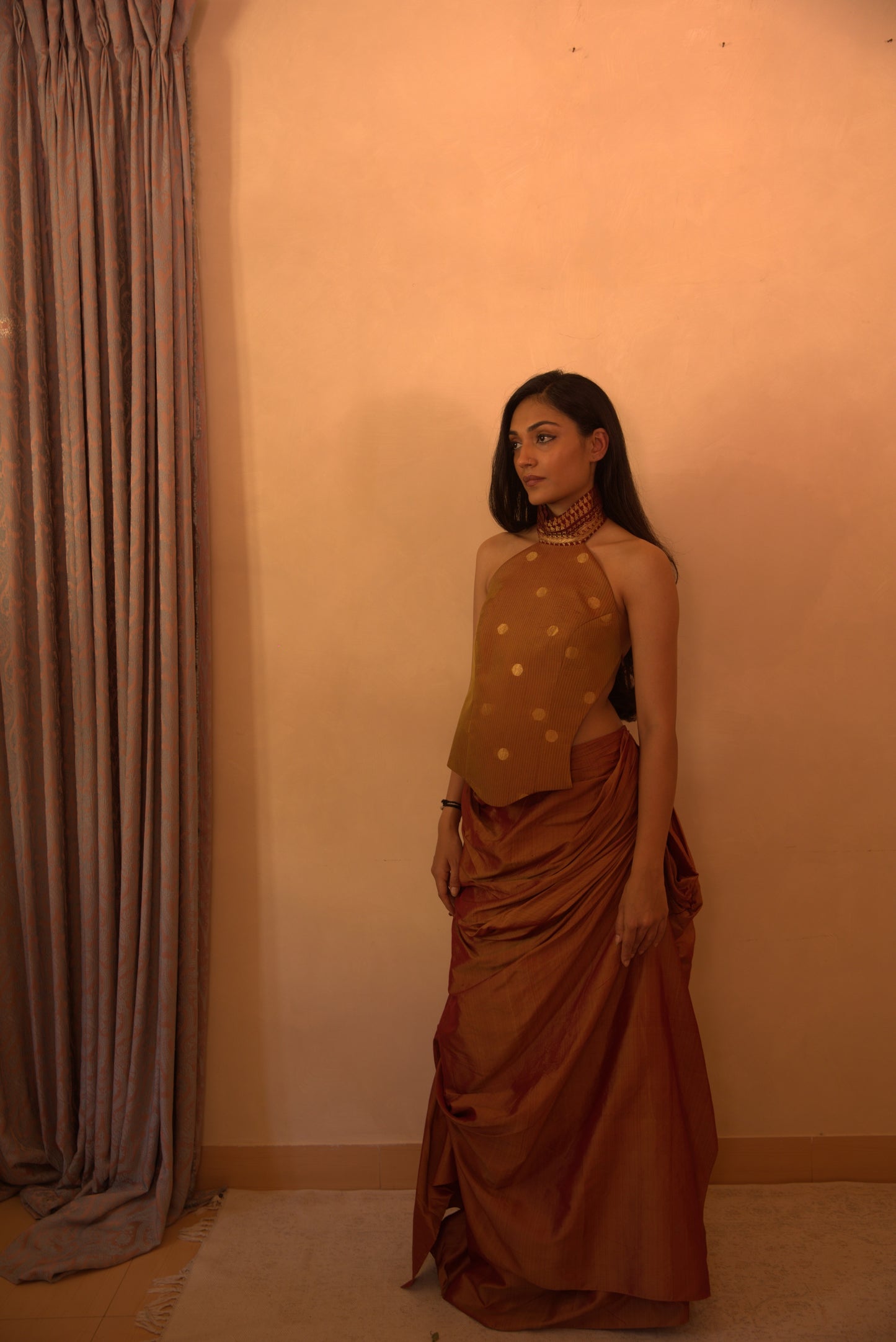 APSARA VII is our high-neck, backless top crafted from a vintage silk saree, inhouse by skilled artisans.