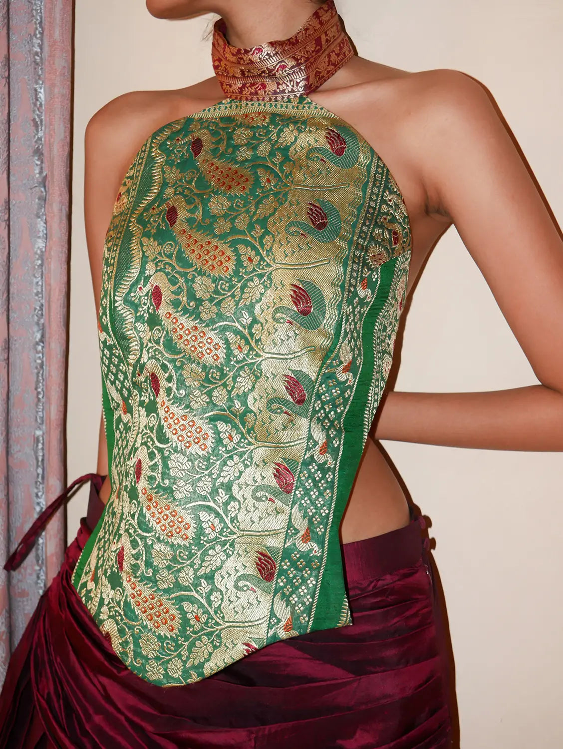 APSARA VIII.II is our high-neck, backless top crafted from a vintage silk saree, inhouse by skilled artisans. 