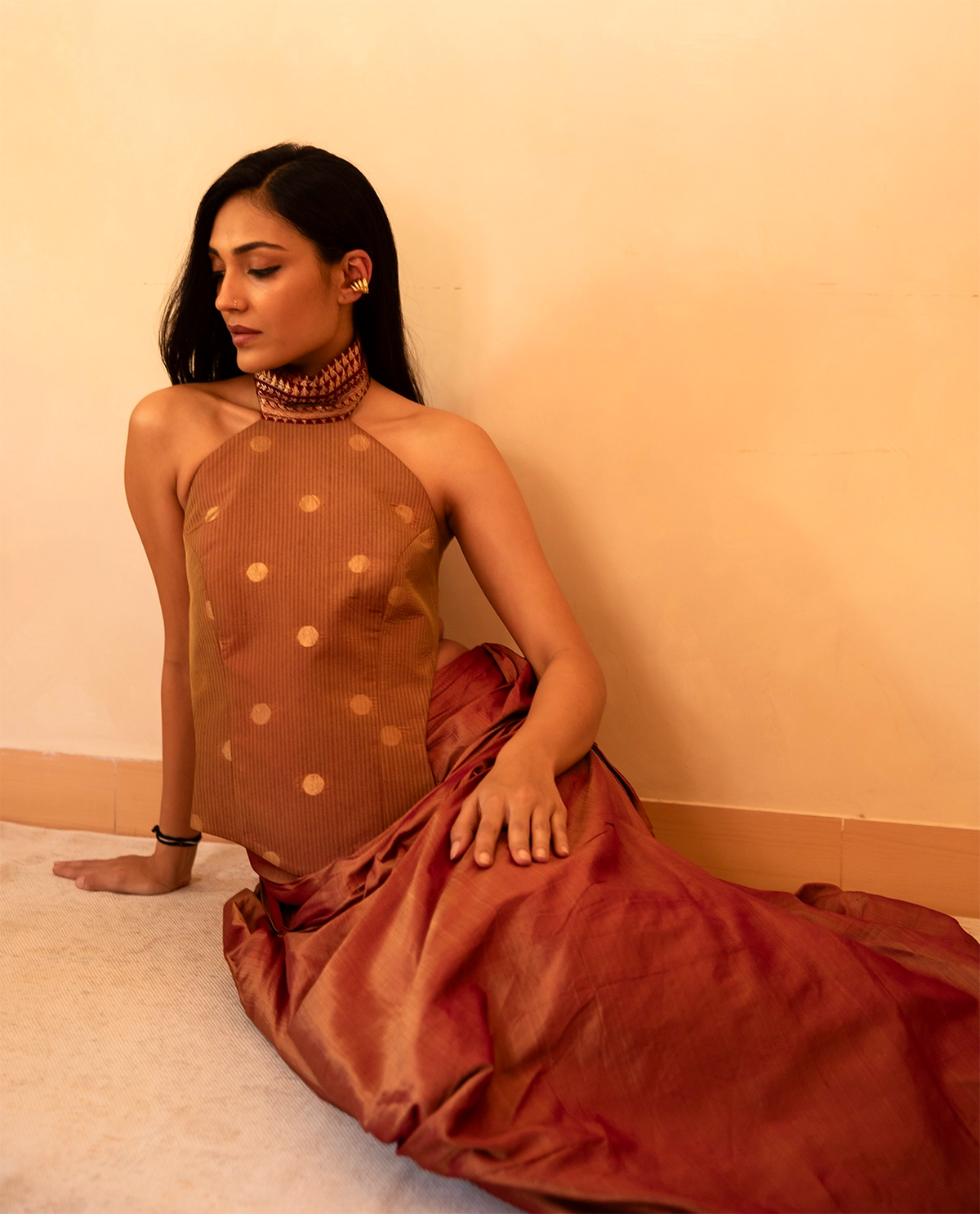 APSARA VII is our high-neck, backless top crafted from a vintage silk saree, inhouse by skilled artisans.