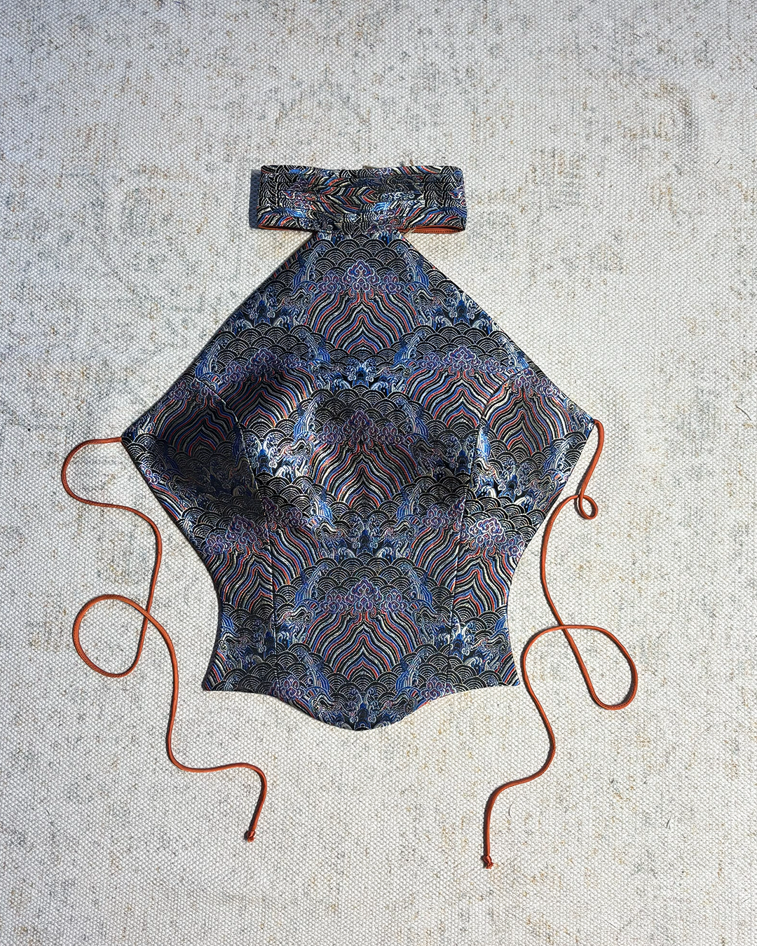 APSARA VI is our high-neck, backless top crafted from a vintage silk saree, inhouse by skilled artisans. 