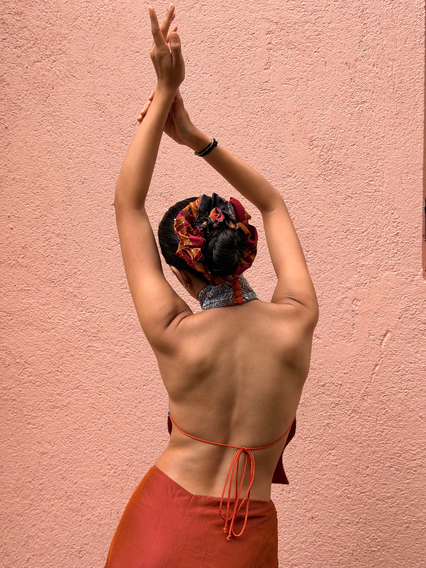 APSARA VI is our high-neck, backless top crafted from a vintage silk saree, inhouse by skilled artisans. 