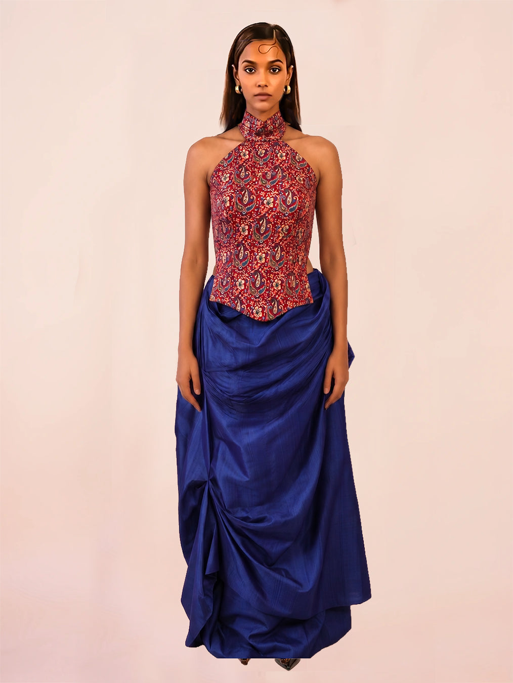 APSARA is our high-neck, backless top crafted from a vintage silk saree, inhouse by skilled artisans.