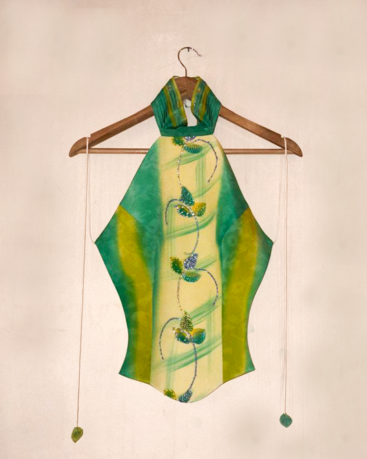 APSARA is our high-neck, backless top crafted from a vintage silk saree, inhouse by skilled artisans. 