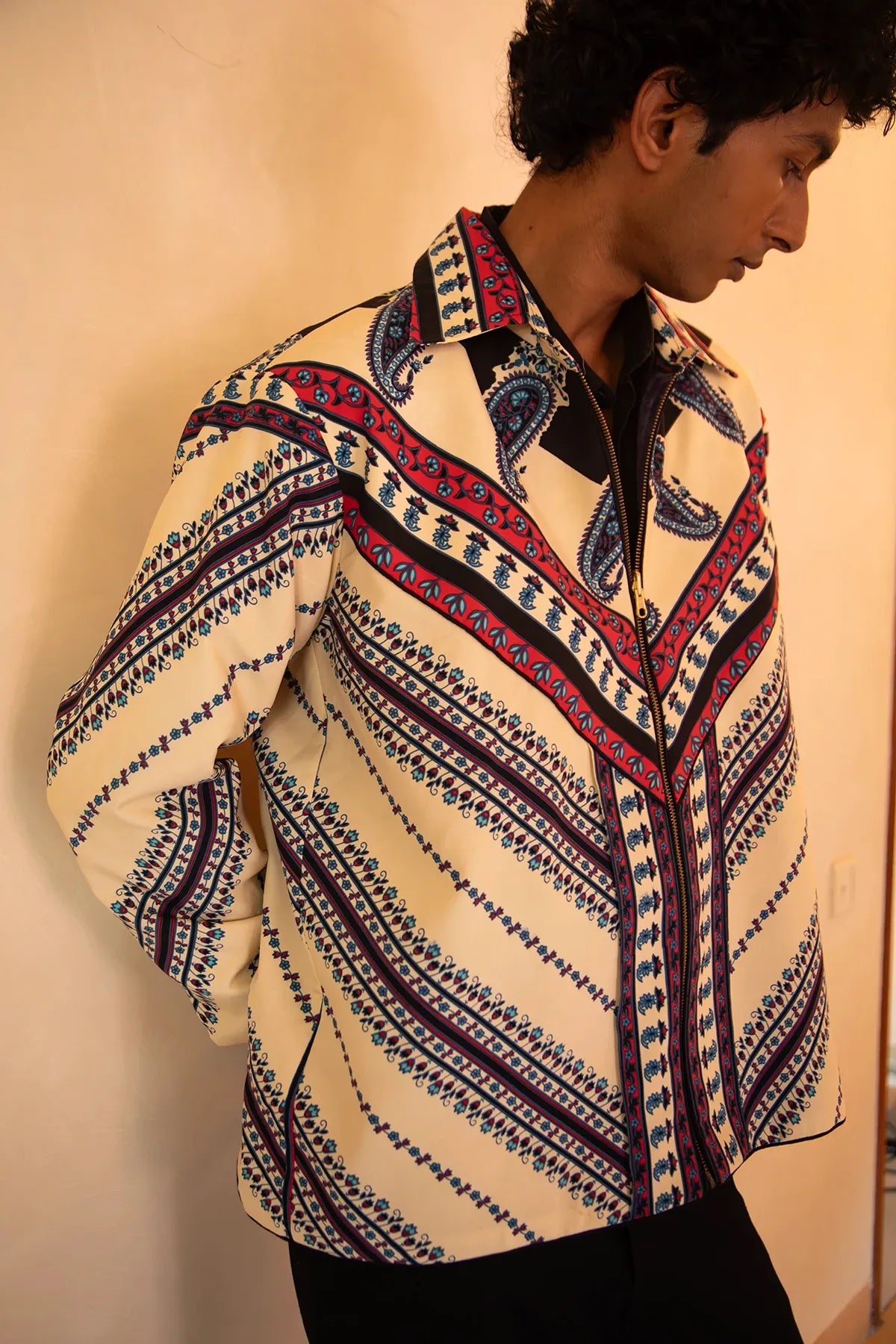 Aksa Bomber IV is our one-of-a-kind printed silk bomber jacket, handcrafted by skilled artisans in-house using a one-of-a-kind vintage silk saree.