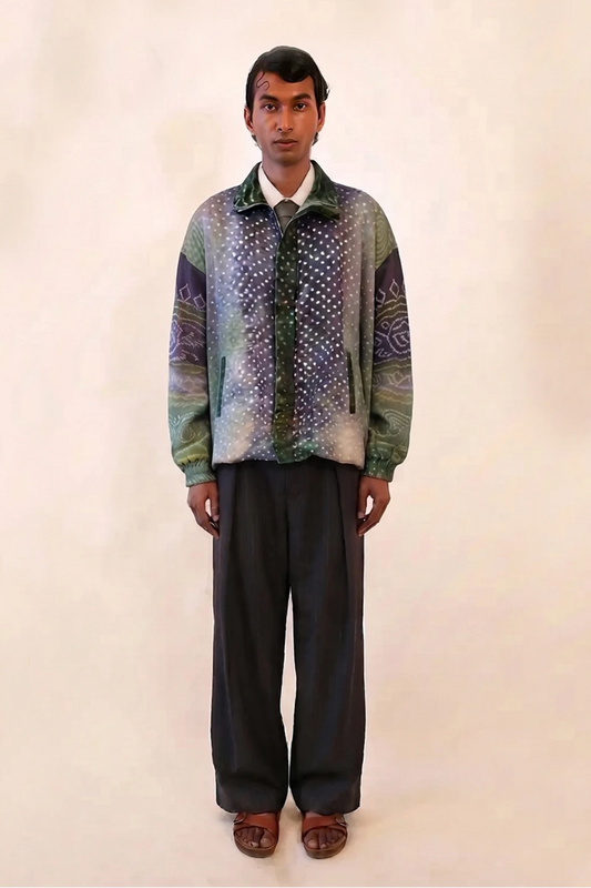 The bomber is a printed silk bomber jacket handcrafted in house from two one of a kind vintage Bandhani sarees