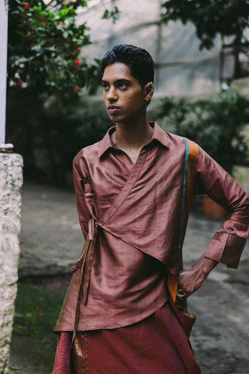 Vastram asymmetrical tunic with patch sleeves paired with Pancha drape skirt featuring bordered hem.