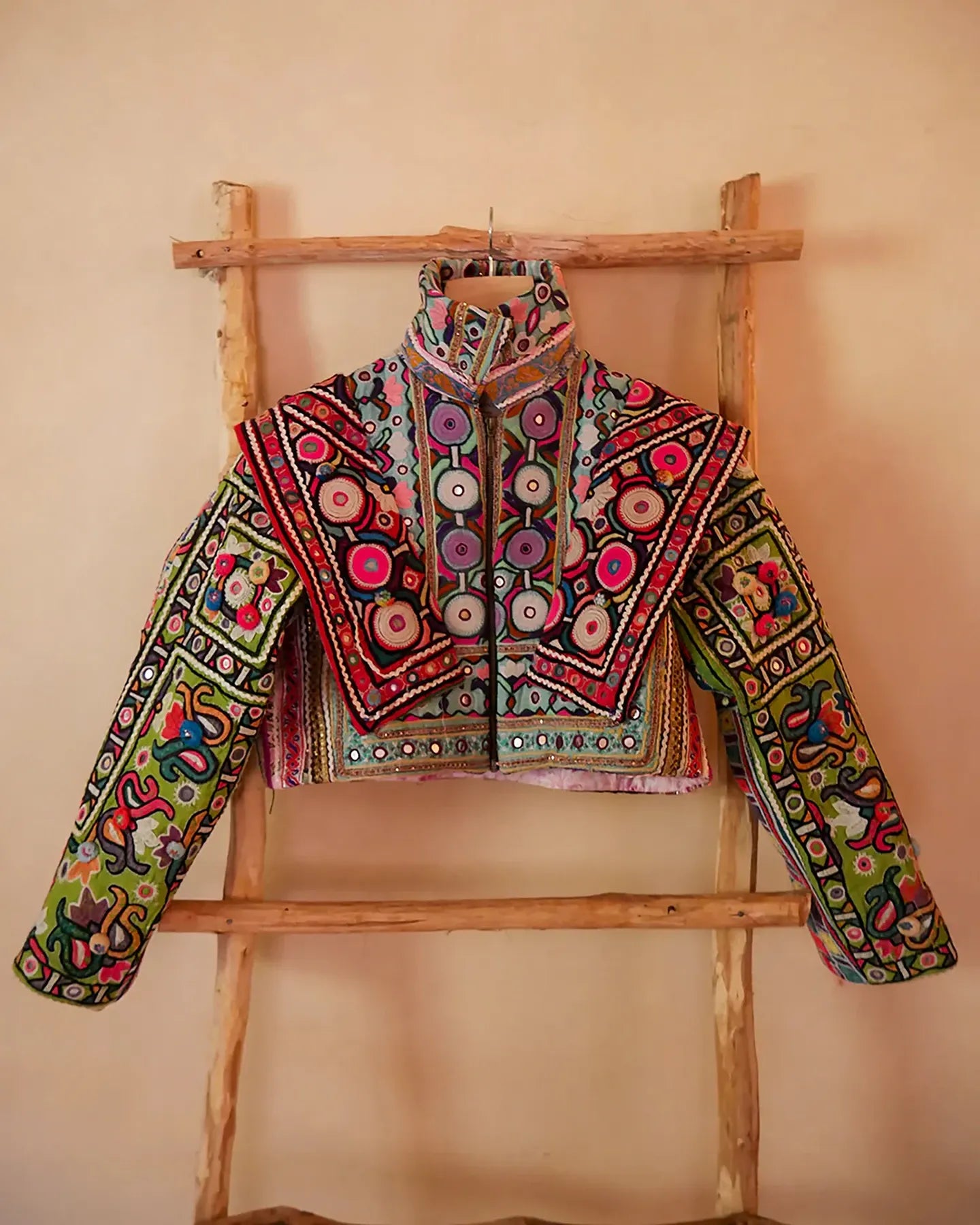 Chola No. II hand-embroidered jacket made from vintage Rabari Cholis with intricate threadwork, mirror detailing, and bold motifs in a contemporary silhouette.