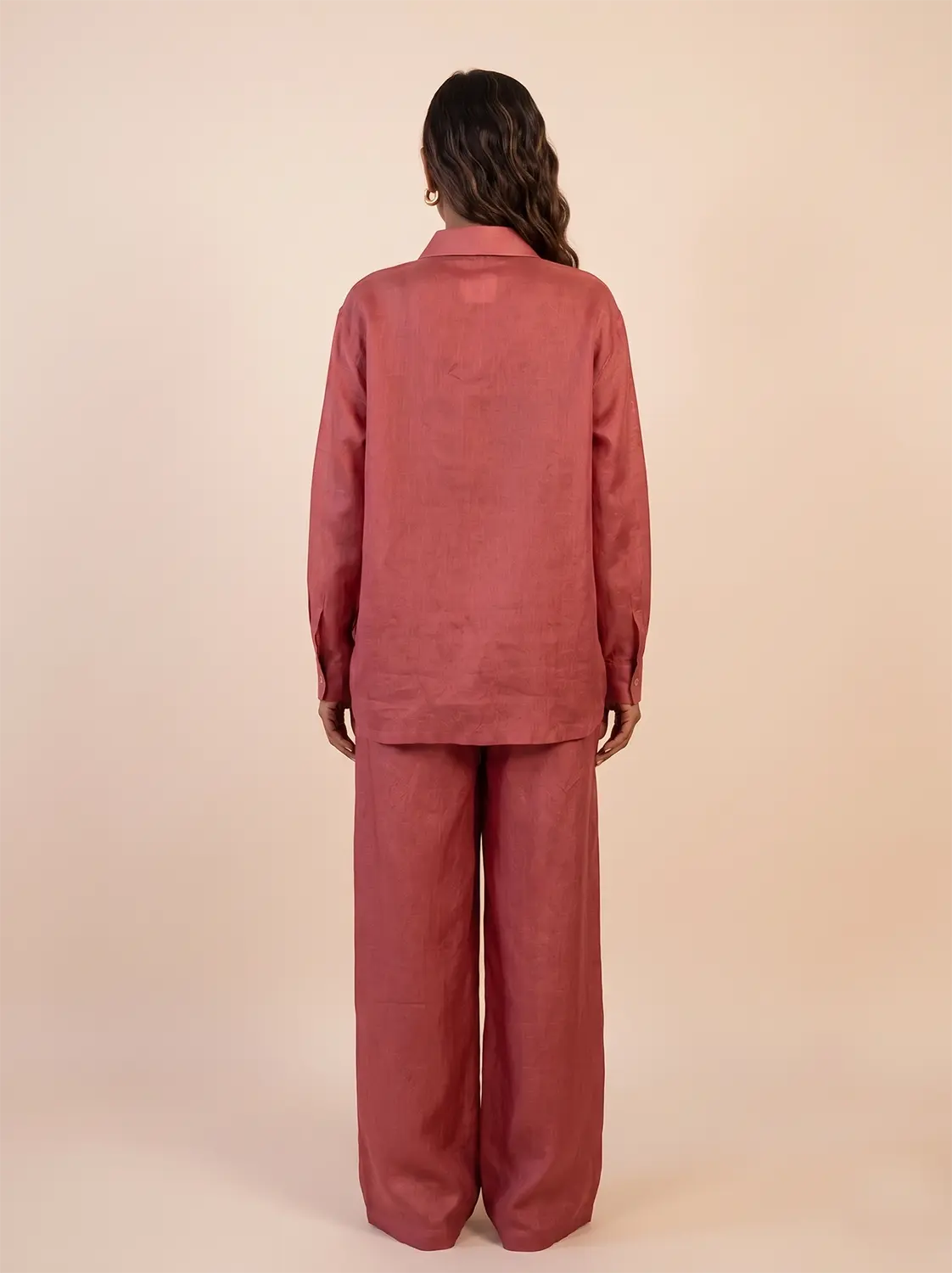 A relaxed co-ord set featuring a simple silk shirt, Designed for effortless wear