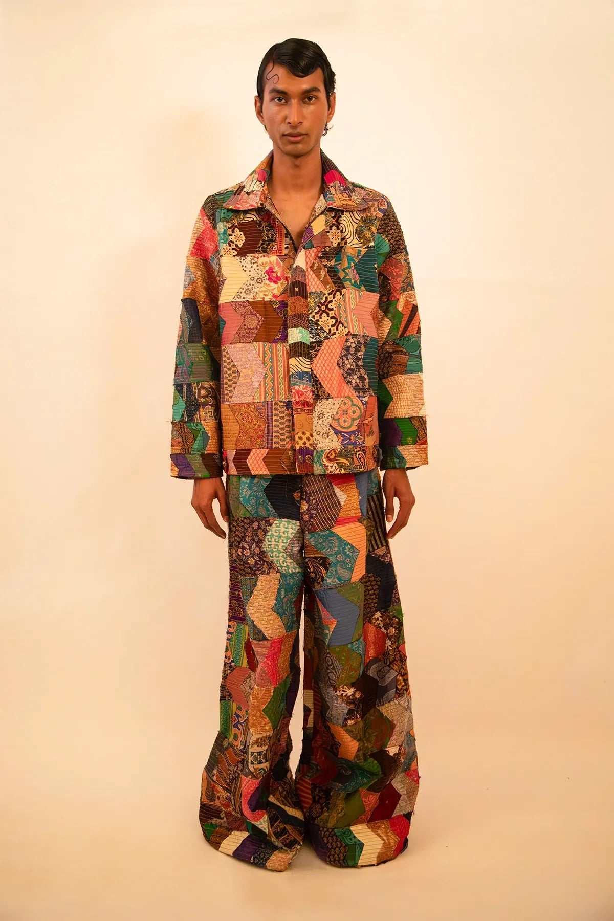 One-of-a-kind patchwork bomber jacket and wide-leg trouser set, handcrafted using upcycled chindis collected over three years, celebrating zero-waste design and mindful craftsmanship