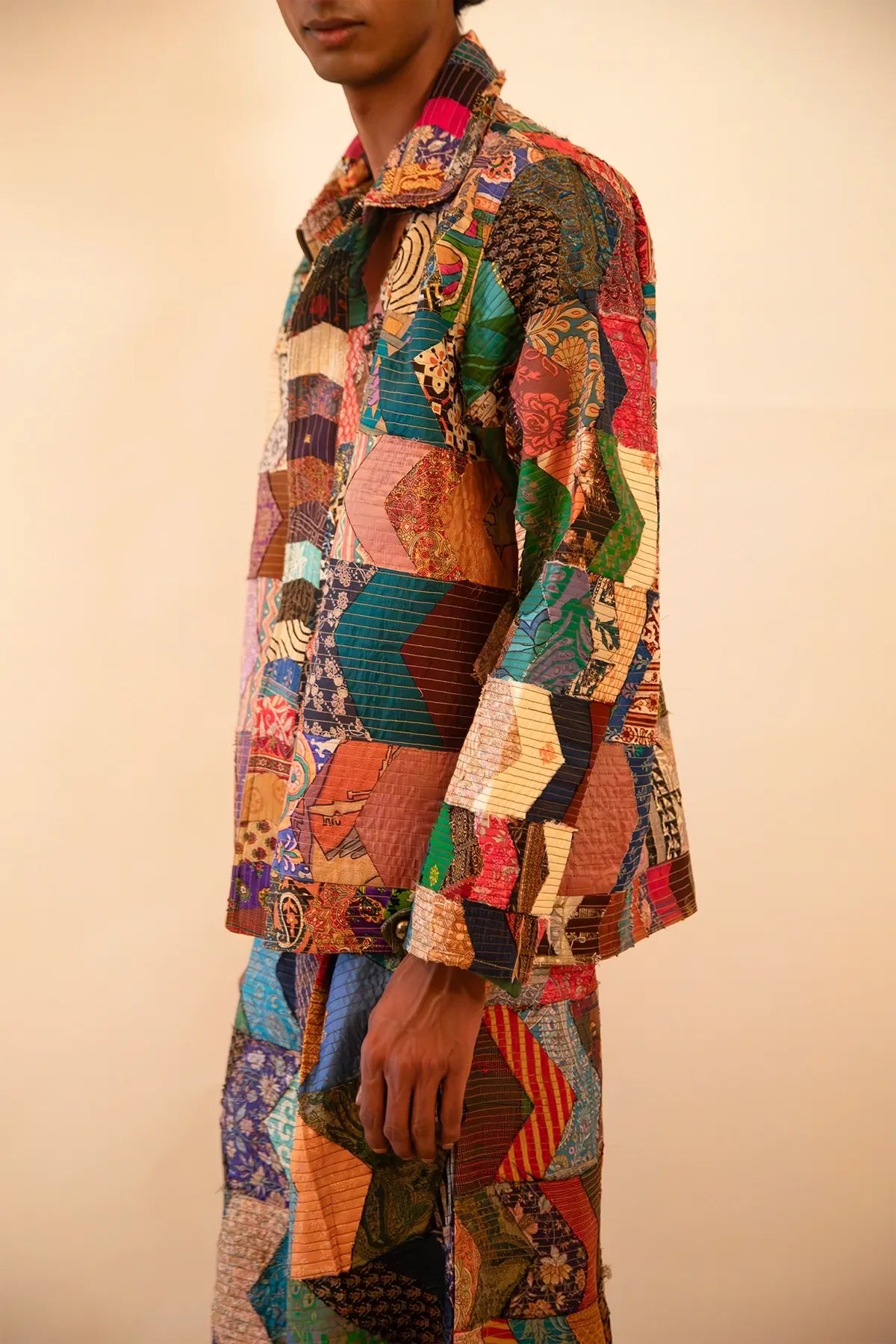 One-of-a-kind patchwork bomber jacket and wide-leg trouser set, handcrafted using upcycled chindis collected over three years, celebrating zero-waste design and mindful craftsmanship