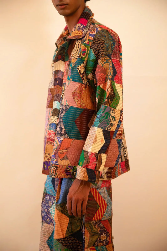 One-of-a-kind patchwork bomber jacket and wide-leg trouser set, handcrafted using upcycled chindis collected over three years, celebrating zero-waste design and mindful craftsmanship