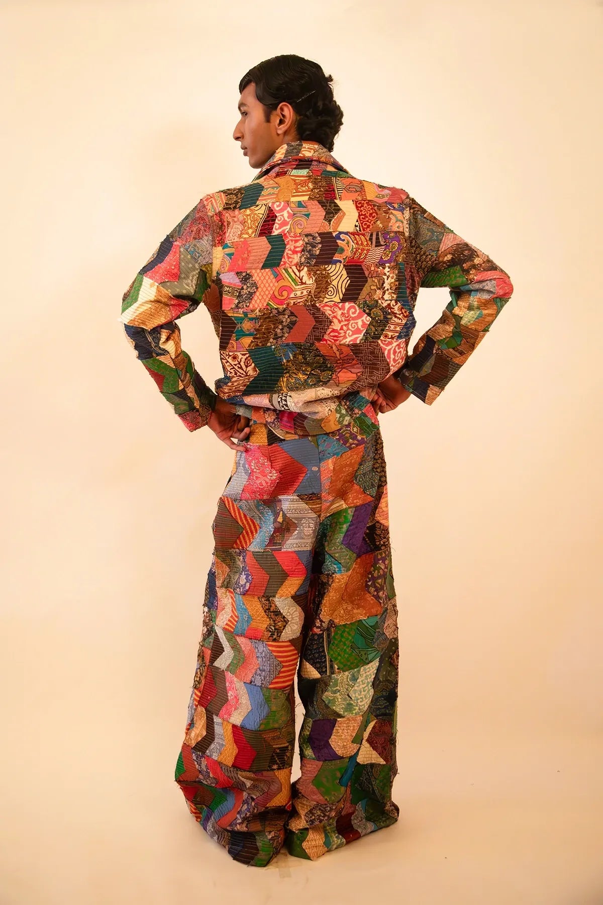 One-of-a-kind patchwork bomber jacket and wide-leg trouser set, handcrafted using upcycled chindis collected over three years, celebrating zero-waste design and mindful craftsmanship