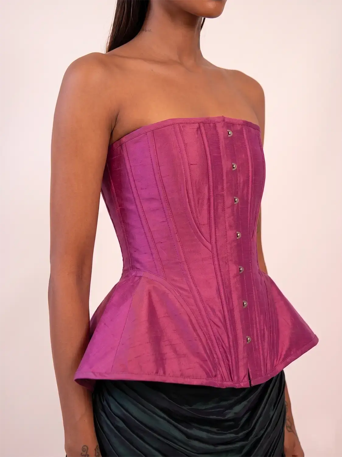 KAMAL is a one-of-a-kind bell corset, handcrafted by skilled artisans in-house using a vintage silk saree. 