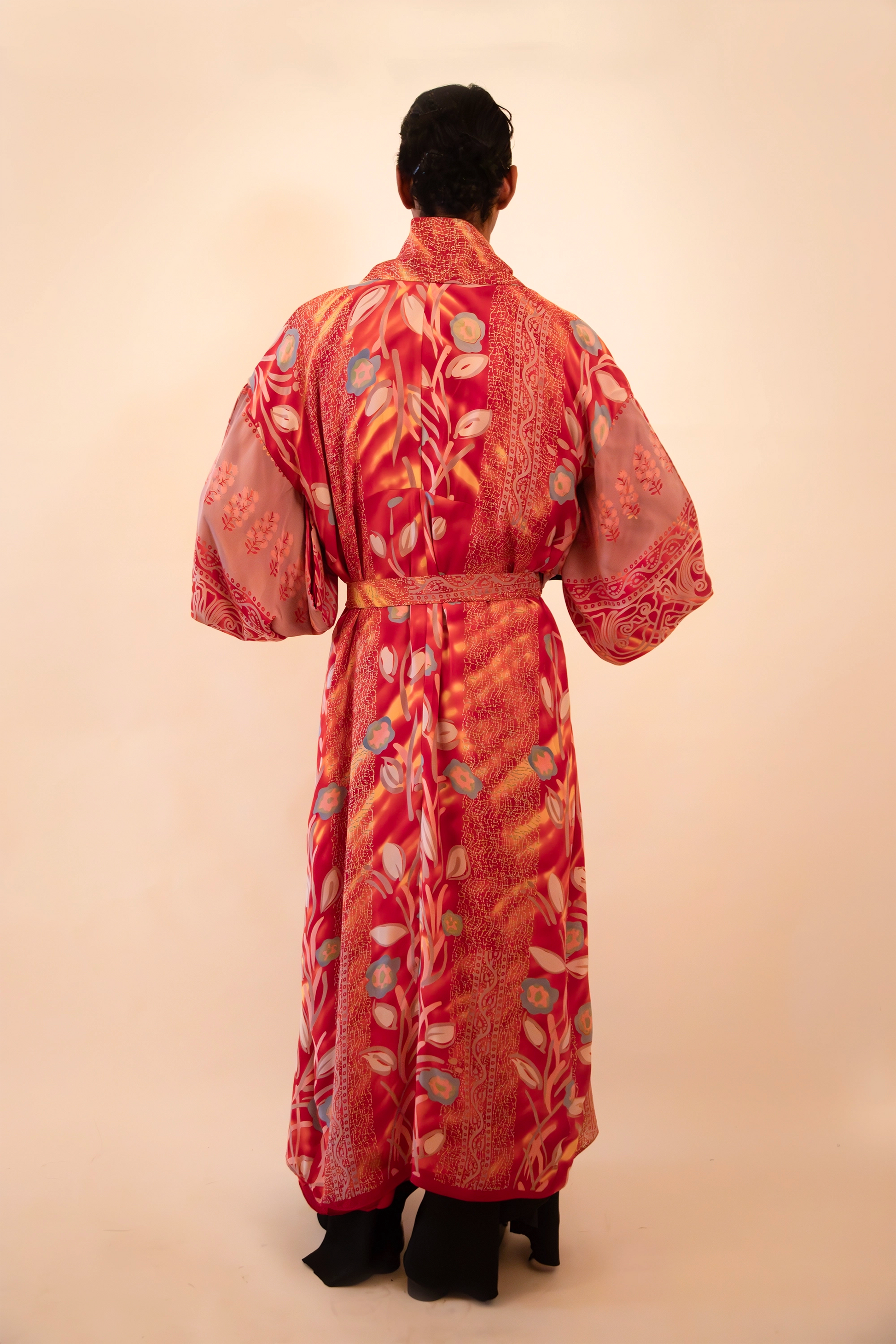 Lalita is our one-of-a-kind red printed silk kimono, handcrafted by skilled artisans in-house using a vintage silk sari.