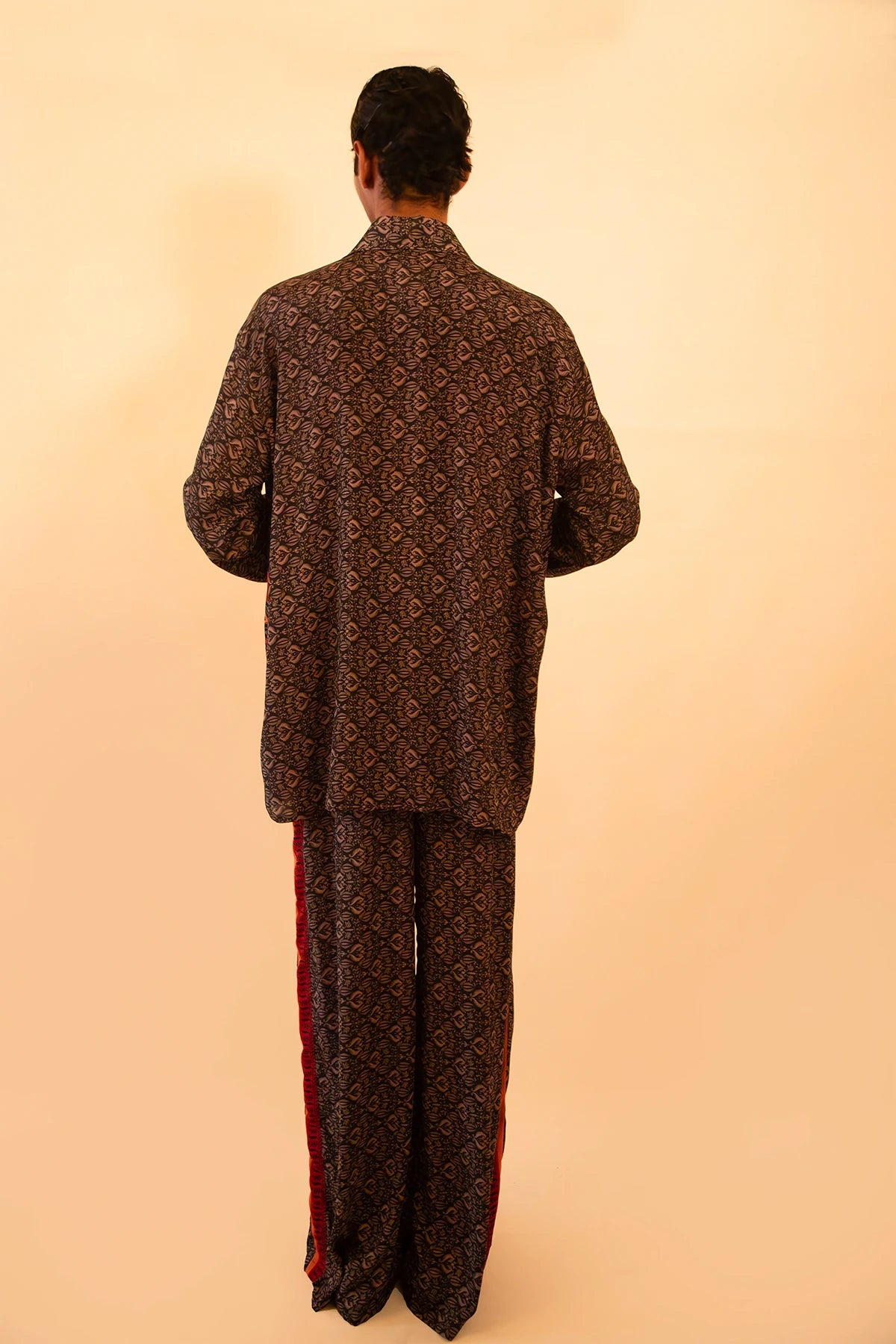 Black and red silk shirt and pant set handcrafted from a vintage sari, featuring a relaxed fit, soft breathable texture, and contrast button detailing