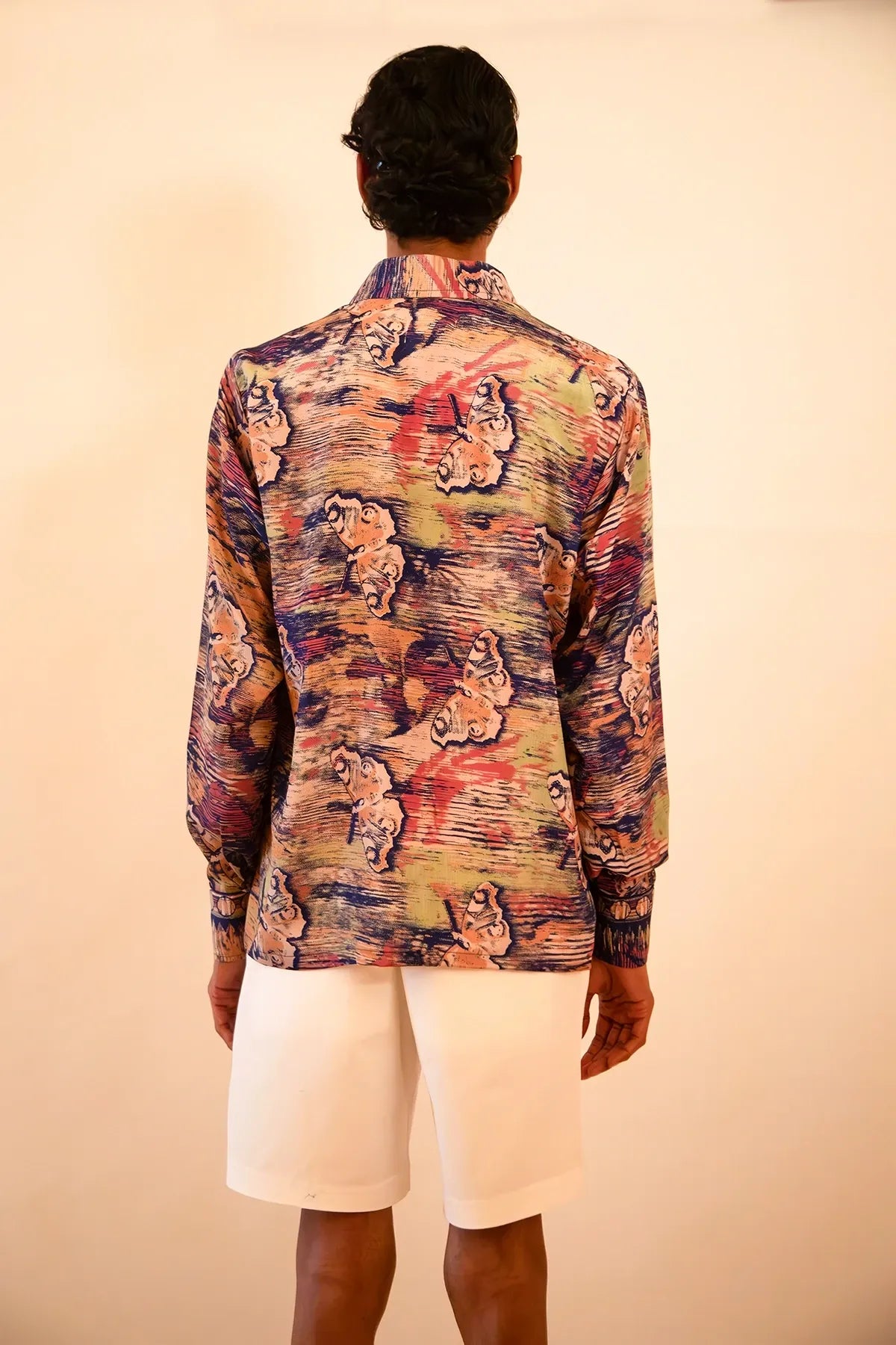 LAVYA is a one-of-a-kind full-sleeve shirt, crafted from vintage fabric in a bold multicolour butterfly print.