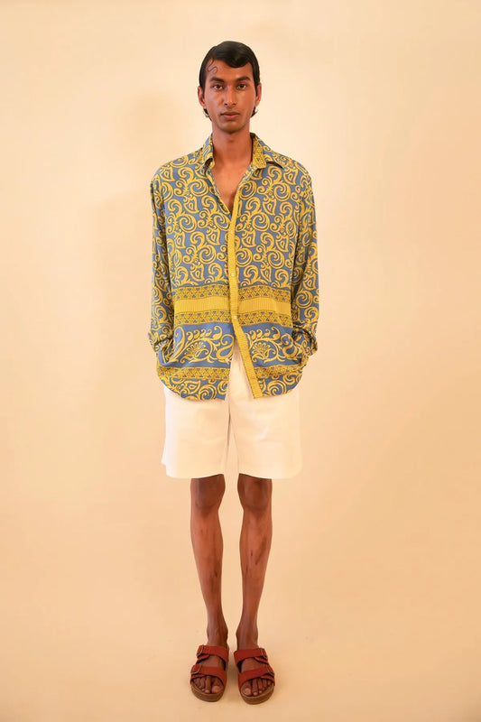 Baroque-printed silk shirt handcrafted from a vintage sari, featuring a relaxed unisex fit, full sleeves, contrast piping, and a soft drape, celebrating slow fashion and timeless craft.