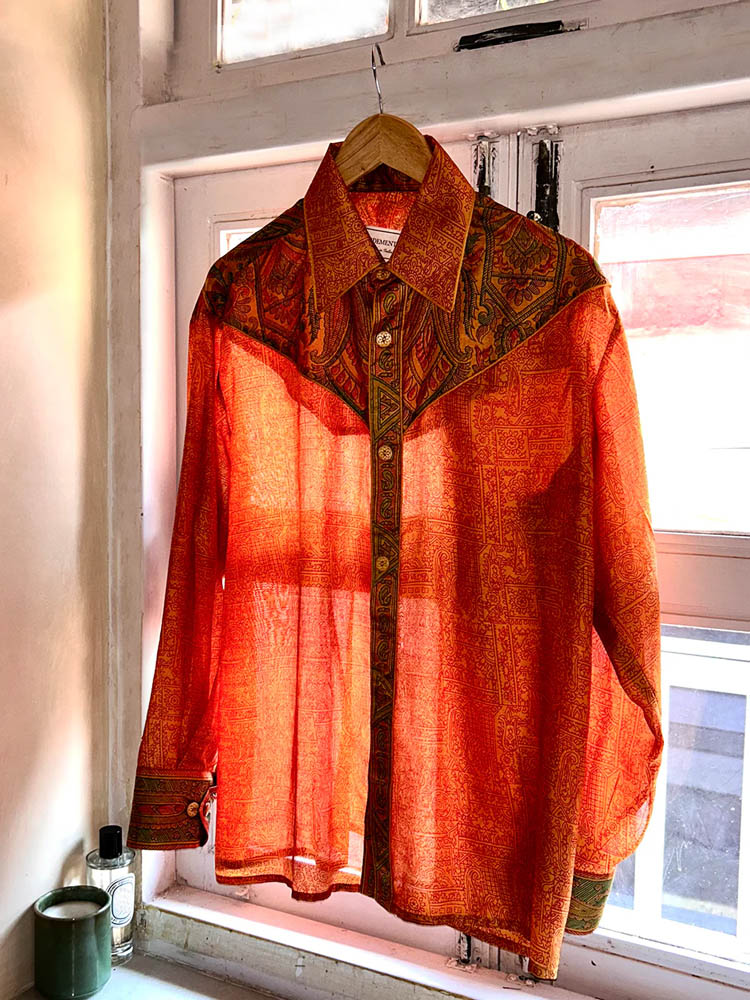 LAVYA vintage full-sleeve shirt in bold orange print with detailed collar and button placket, relaxed fit breathable fabric for effortless movement.