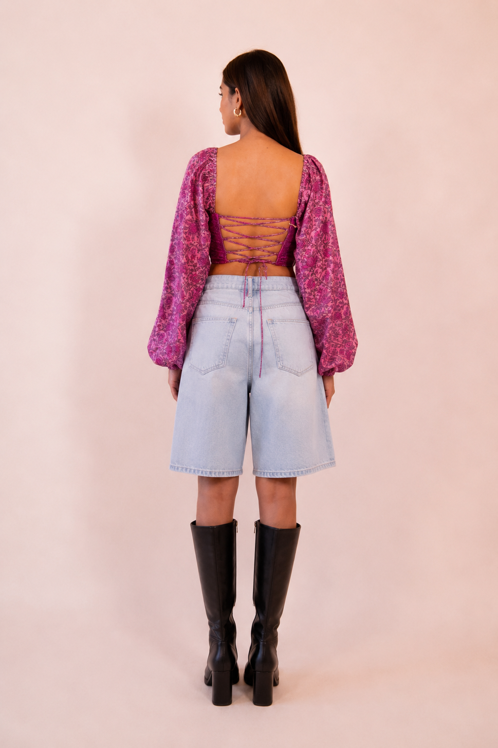NAMYA is a one of a kind corset with sleeves, handcrafted in house from a vintage printed pure silk saree. 