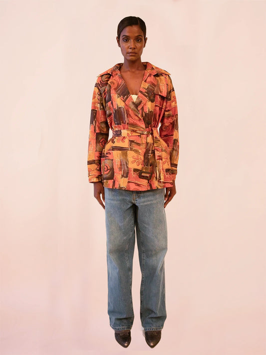 NIRA is our one-of-a-kind cropped abstract print silk trench coat, handcrafted by skilled artisans in-house using a one-of-a-kind vintage silk saree.