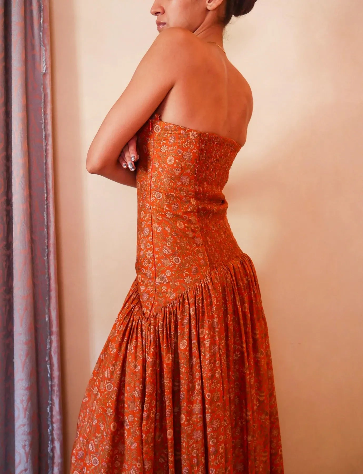 Noor orange printed silk drop-waist dress handcrafted from vintage saree with smocked back, elongated bodice and flowy skirt.