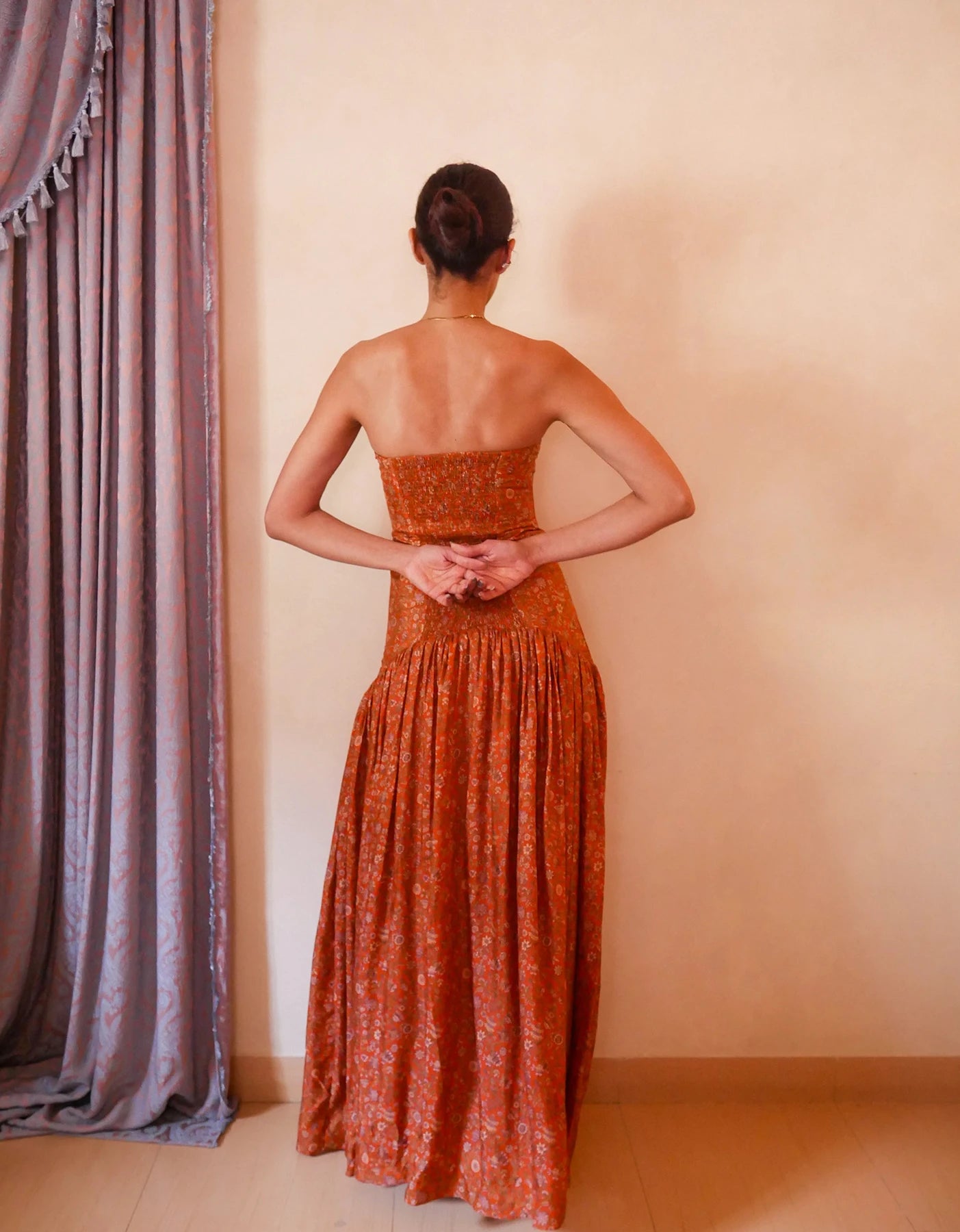 Noor orange printed silk drop-waist dress handcrafted from vintage saree with smocked back, elongated bodice and flowy skirt.