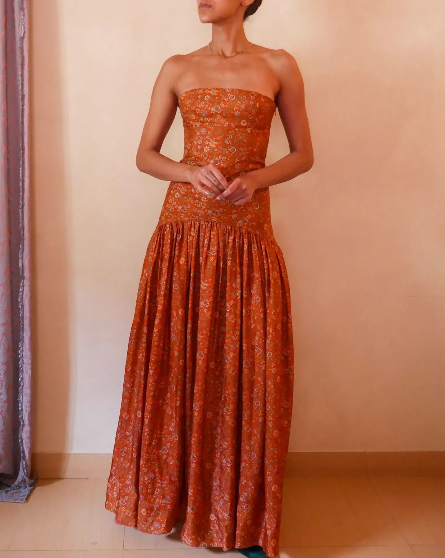 Noor orange printed silk drop-waist dress handcrafted from vintage saree with smocked back, elongated bodice and flowy skirt.