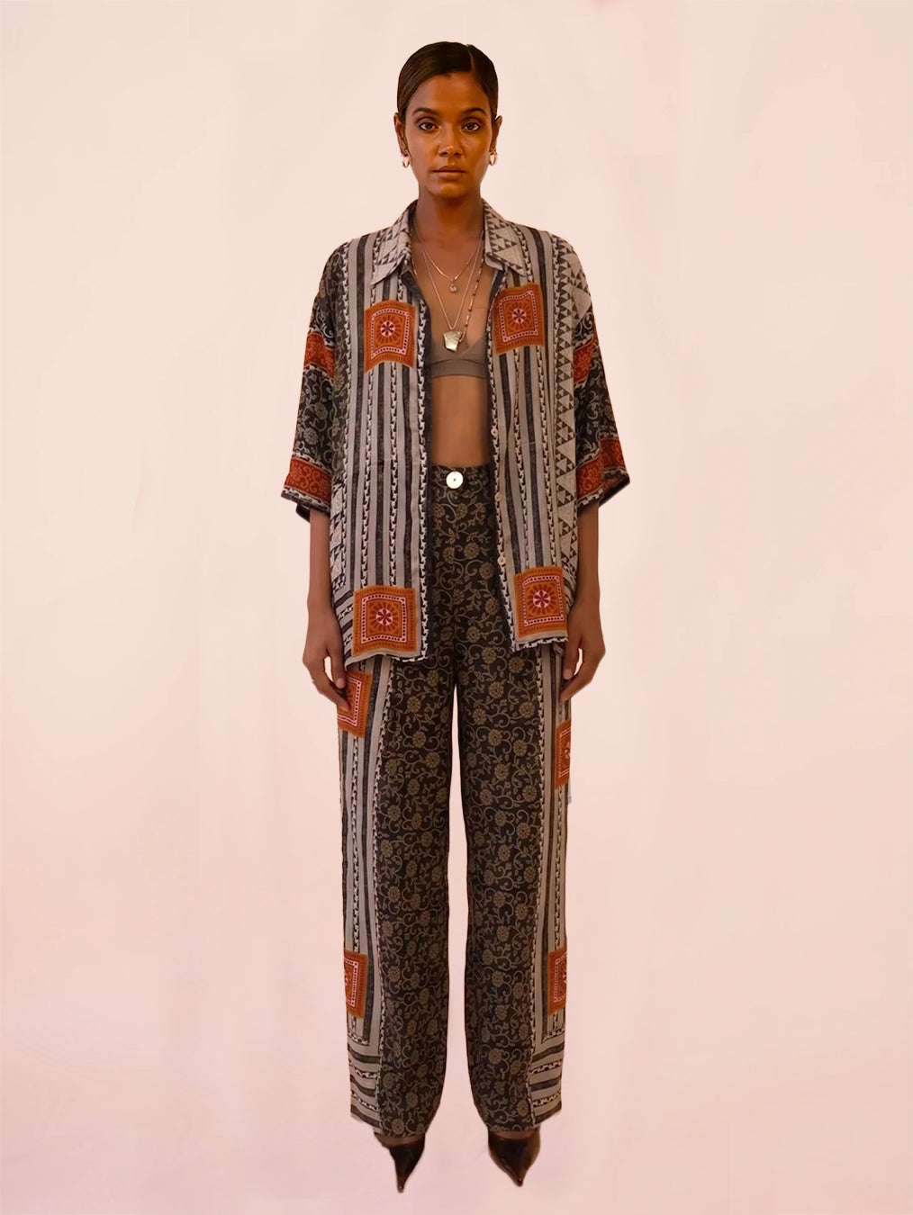 OJAS SHIRT is our one of a kind oversized printed silk shirt, handcrafted by skilled artisans in house using a vintage silk saree. 