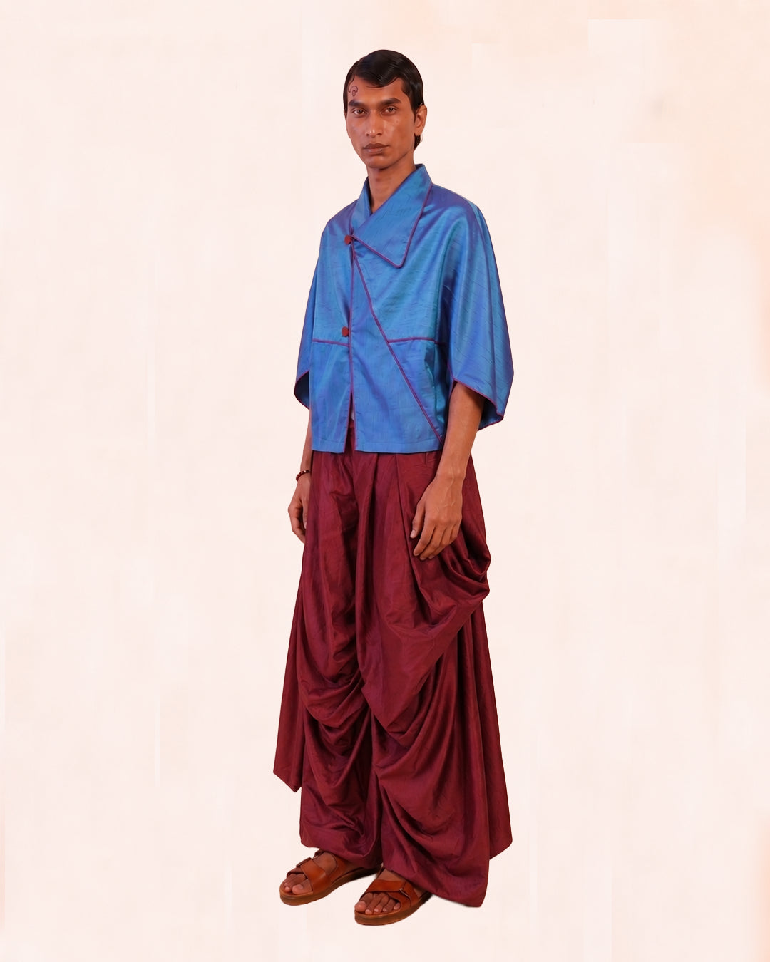 PATANG TOP is our one-of-a-kind top, handcrafted in-house from a single square of fabric, folded seamlessly into form without any cuts or waste. 