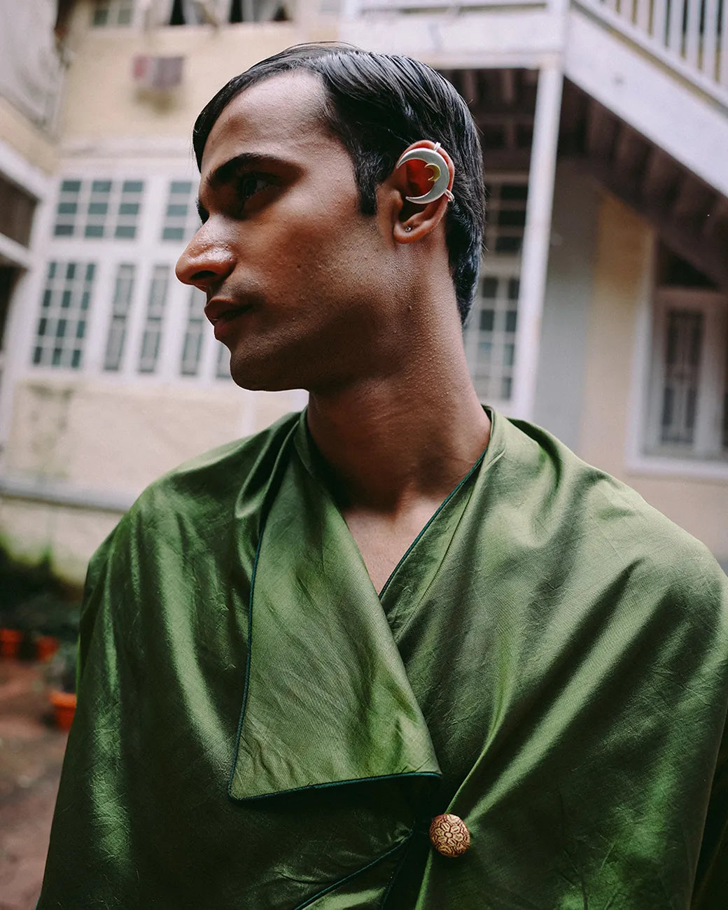 Patang zero-waste folded top with fabric button paired with Paunji dhoti pants featuring structured hem and ankle buttons