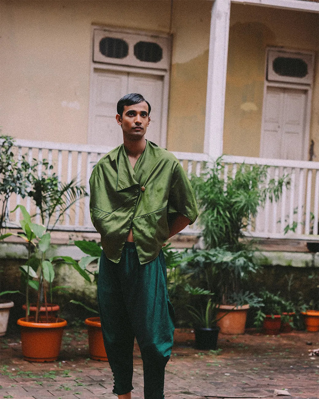 Patang zero-waste folded top with fabric button paired with Paunji dhoti pants featuring structured hem and ankle buttons