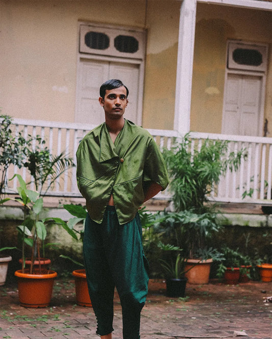 Patang zero-waste folded top with fabric button paired with Paunji dhoti pants featuring structured hem and ankle buttons