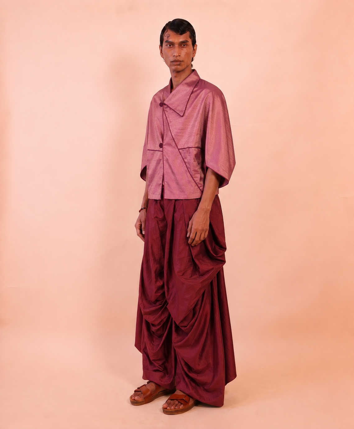 PATANG TOP is our one-of-a-kind top, handcrafted in-house from a single square of fabric, folded seamlessly into form without any cuts or waste. 