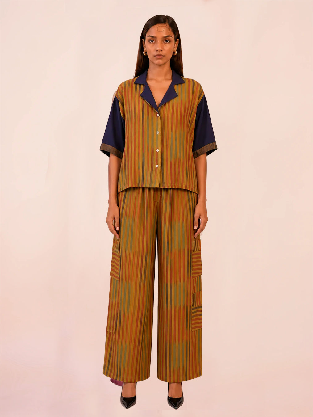 RAGA XII PANT SET is our one of a kind printed silk shirt and pant set, handcrafted by skilled artisans in house using a vintage silk saree. 