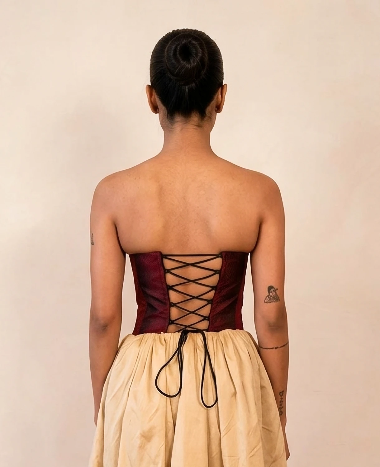 four-panel corset crafted from a vintage Maroon silk sari, featuring V-cut detailing and adjustable lace-up panels, consciously handcrafted by Bodements to celebrate heritage, craft, and mindful fashion.