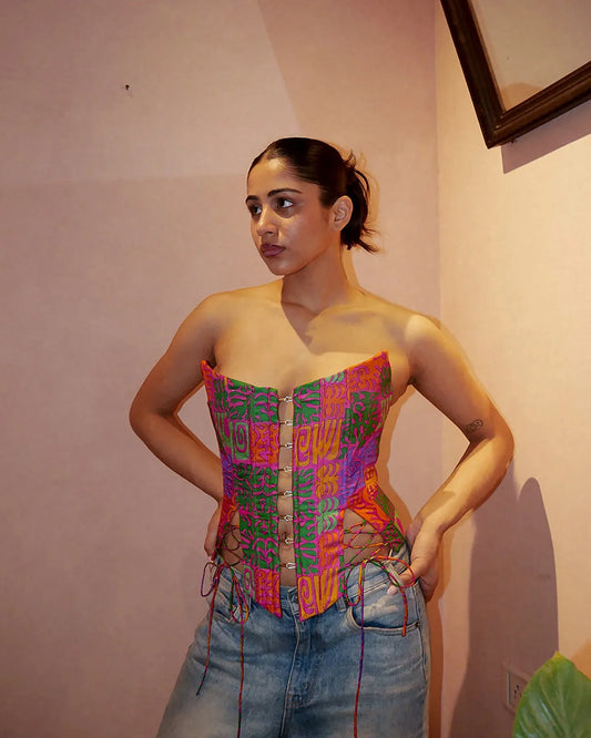 RAINA is our one-of-a-kind four-panel corset, handcrafted in-house using a vintage silk saree. 
