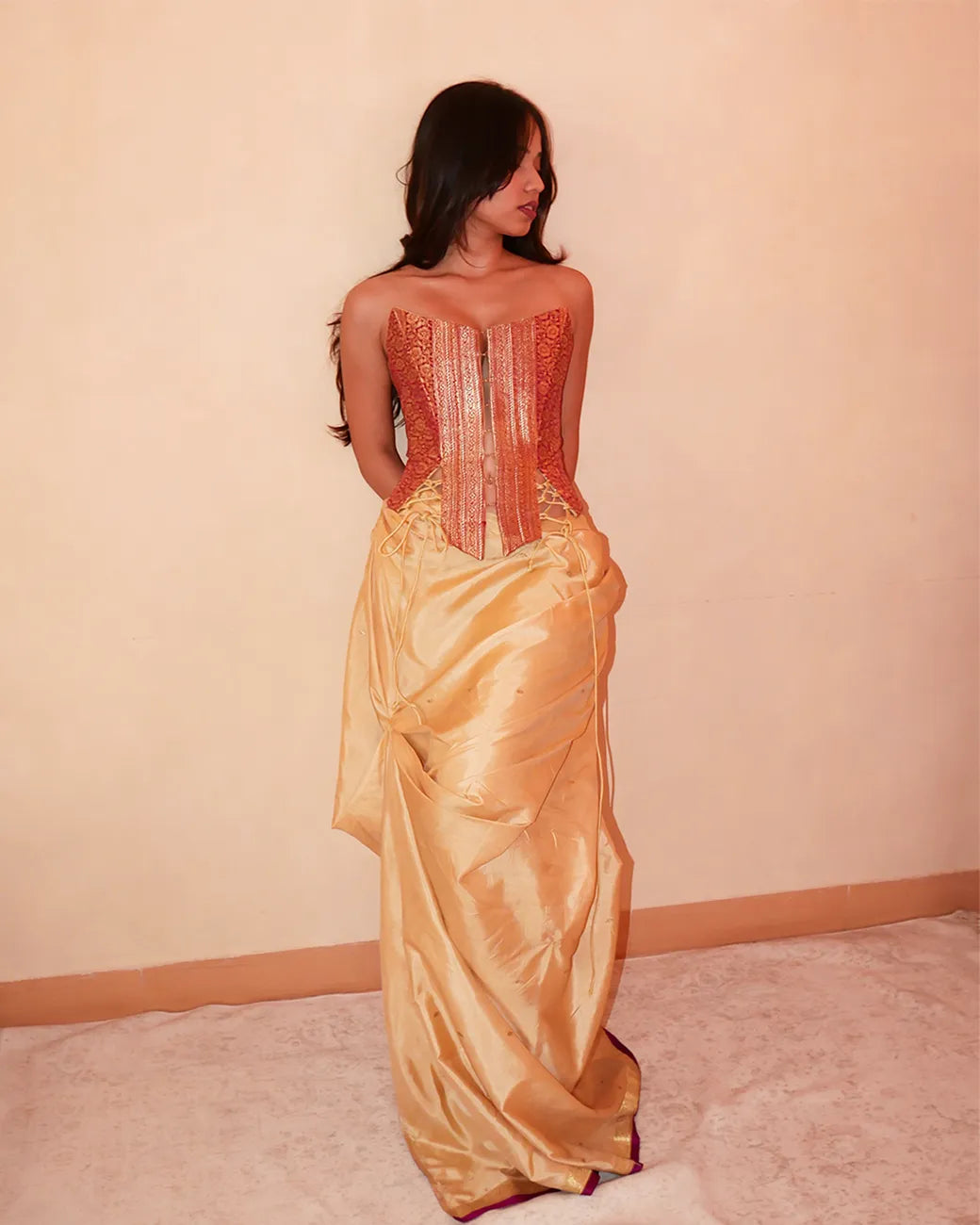 Raina is our one-of-a-kind four-panel corset, handcrafted in-house using a vintage silk saree.