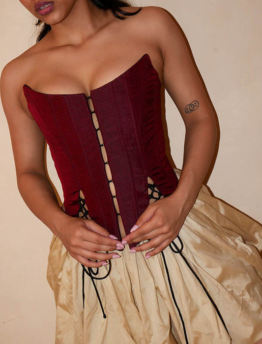 four-panel corset crafted from a vintage Maroon silk sari, featuring V-cut detailing and adjustable lace-up panels, consciously handcrafted by Bodements to celebrate heritage, craft, and mindful fashion.